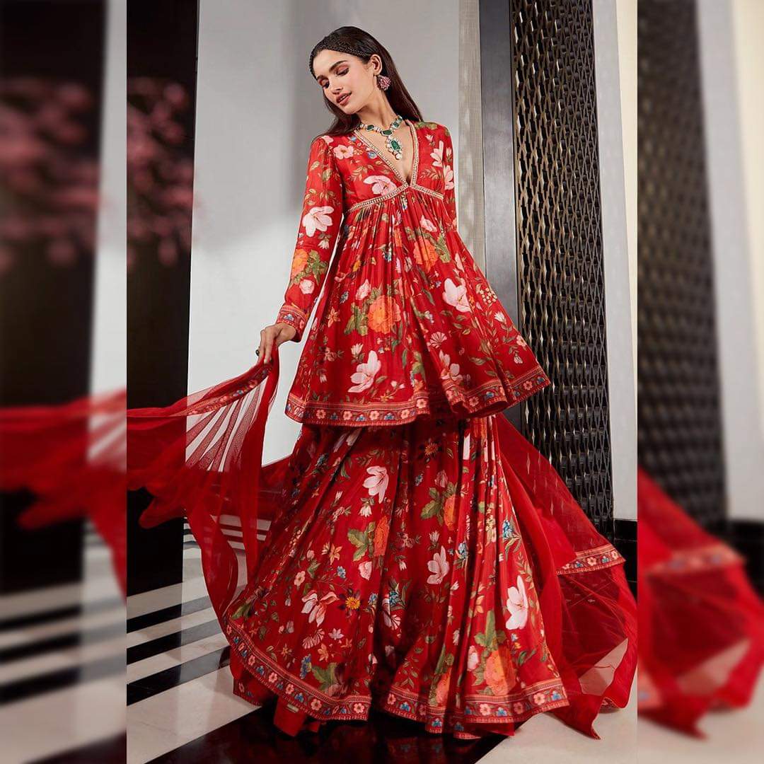 peplum indo western dress Brindha Collection Premium Indo-western Top & Skirt Top: Premium indowestern peplum top featuring intricate yoke and sleeve designs, a stylish high-low peplum cut with sheer transparency. Skirt: Full flared skirt crafted from