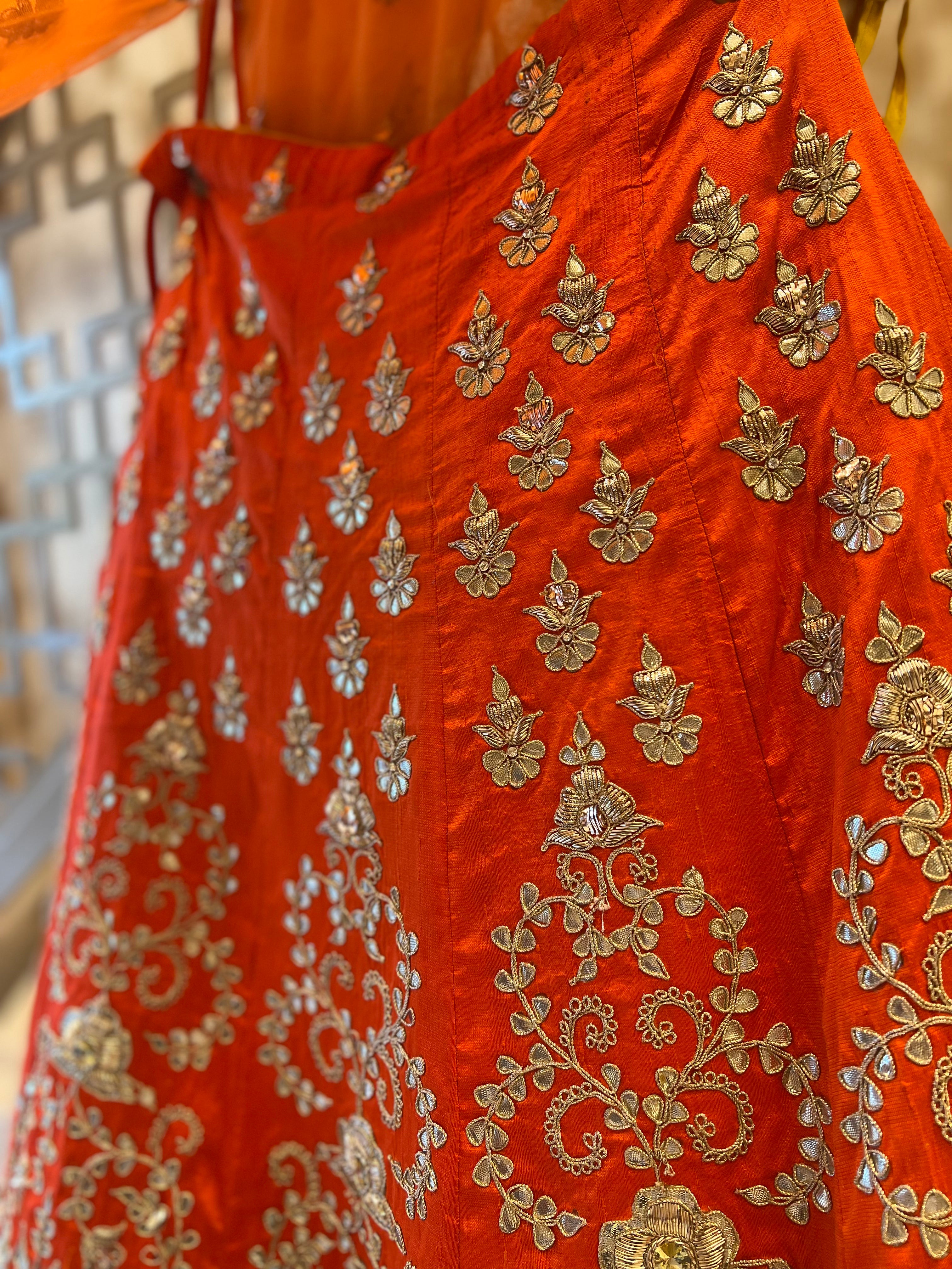 Rust orange fine handwork gotapatti lehenga set