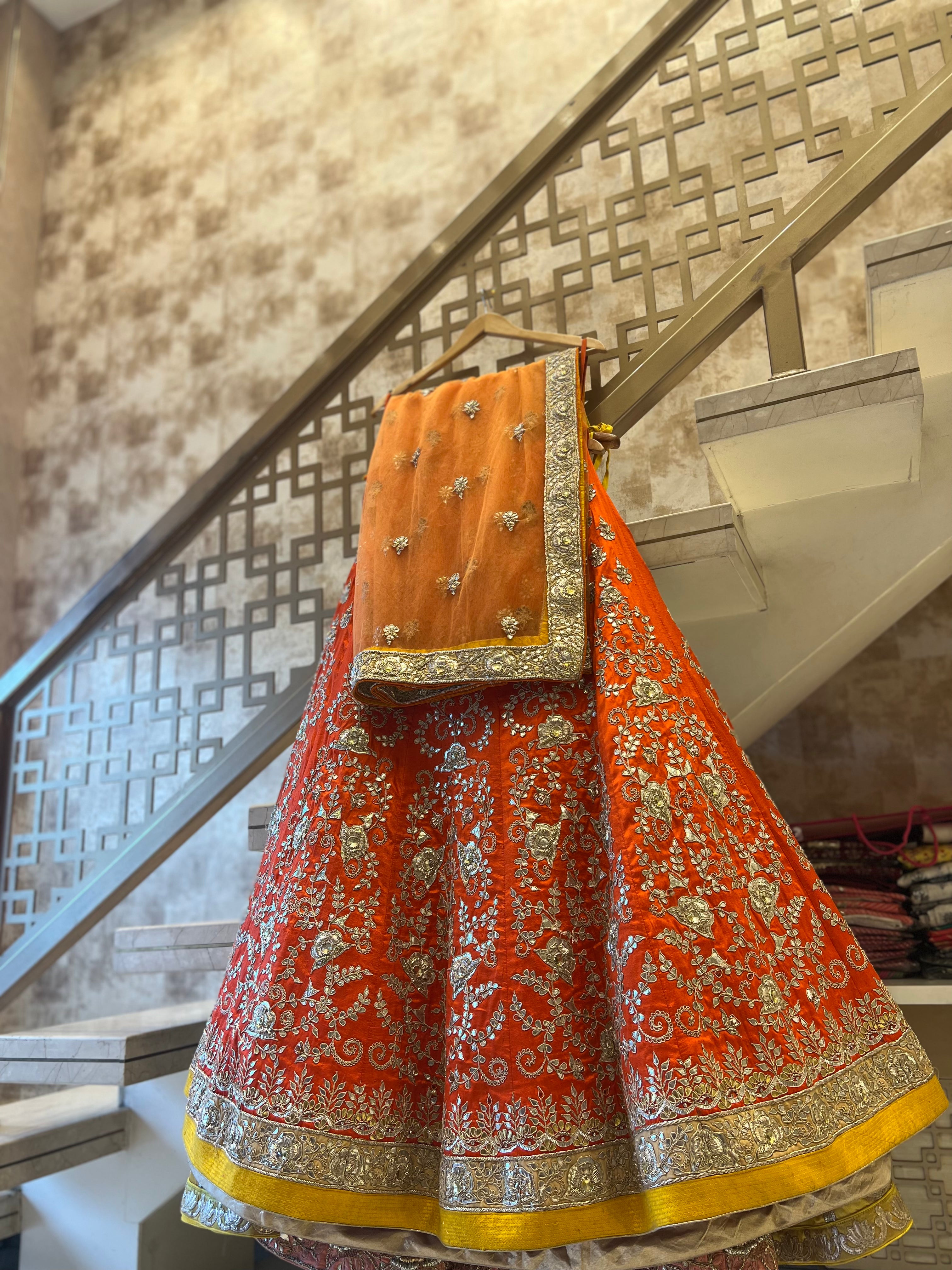 Rust orange fine handwork gotapatti lehenga set